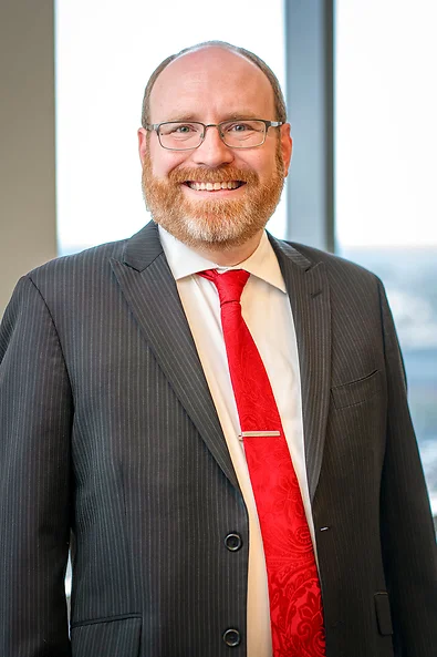 Attorney John Stevenson wearing a suit and tie.